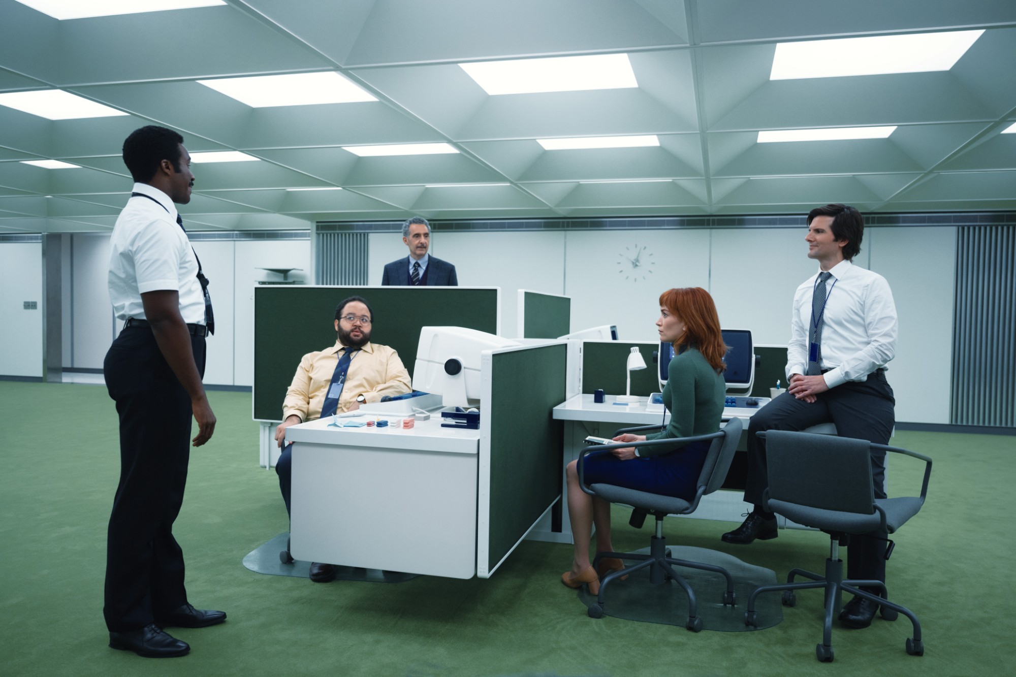 Severance: coworkers gathered around desks in an open-plan office